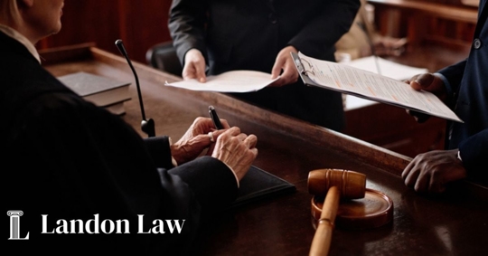 Close-up of accusation and protection sides with juridical documents standing in front of female judge during discussion of case points